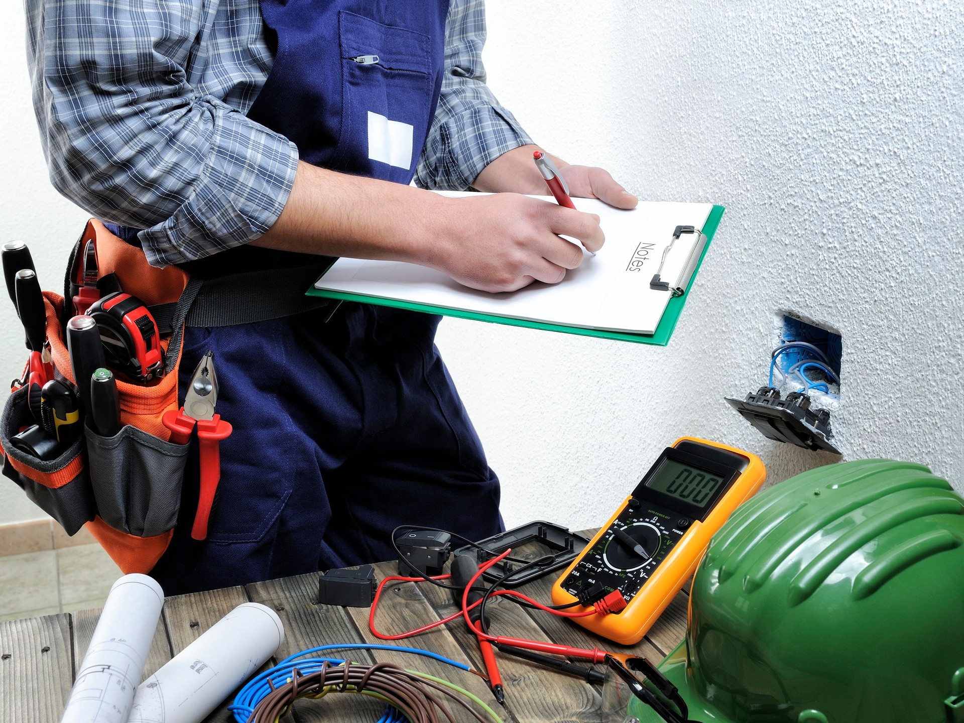 Young electrician working in a residential electrical installation